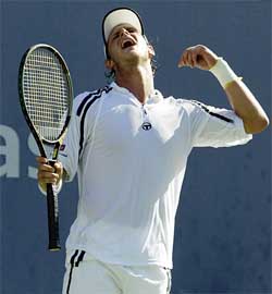 David Nalbandian of Argentina reacts to a missed point against Andy Roddick of the US