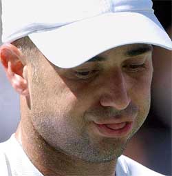 Andre Agassi of the US reacts after losing to Spain's Juan Carlos Ferrero in the semifinal of the US Open