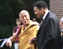The Dalai Lama escorts former heavyweight boxing champion Muhammad Ali for a traditional Tibetan dedication ceremony in Bloomington