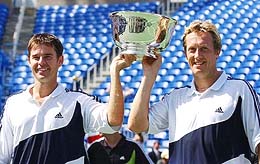 Australia's Rod Woodbridge and Jonas Bjorkman of Sweden pose with their men's doubles championship trophy 