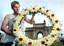 Australian fast bowler Brett Lee places a wreath at the Gateway of India blast site in Mumbai