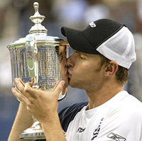 Andy Roddick of the US kisses the trophy after his win over Juan Carlos Ferrero of Spain in the final of the US Open
