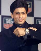 Bollywood star Shah Rukh Khan shows a Tag Heuer wrist watch 