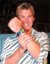 Australian speed king Brett Lee shows a Timex watch 