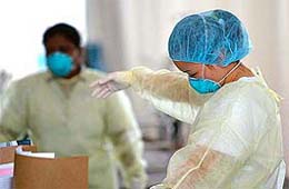 A nurse works at Tan Tock Seng hospital's SARS screening tent in Singapore