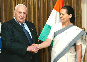 Israeli Prime Minister Ariel Sharon shakes hand with Ms Sonia Gandhi