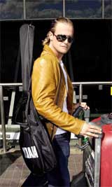 Professional David Beckham look-a-like, Andy Harmer arrives at London's Heathrow Airport 