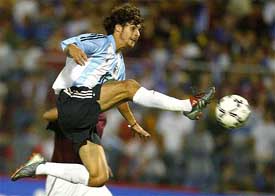 Argentina's Pablo Aimar attempts an acrobatic kick against Venezuela 