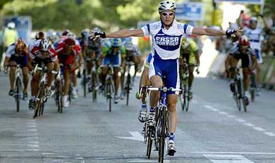 Alessandro Petacchi of Italy raises his arms in celebration as he crosses the finishing line to win the166.7 km fifth stage at the Tour of Spain cycling race 