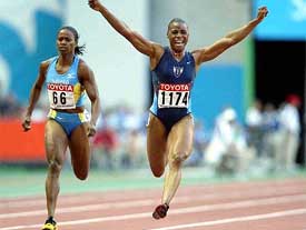 A file photo of Kelli White of the US, celebrating her victory in the women's 100-meter race at the World Athletics Championships