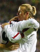 England's Wayne Rooney (left) celebrates with captain David Beckham after his goal in the Euro 2004 qualifier match against Liechtenstein