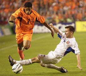 Vladimir Smicer of Czech Republic fights for the ball with Michael Reiziger of the Netherlands 