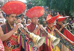 Traditional Buddhist folk musicians perform during a festival