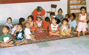 Ms Jessica Cooper, a British student, has fun time with children at the Child Development Centre
