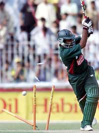 Bangladesh batsman Imran Tushar has his stumps spread-eagled by Pakistan bowler Abdul Razaaq