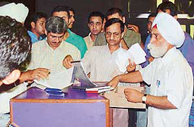 A team of the UT Excise and Taxation Department checks entry tickets at Las Vegas, a discotheque in Sector 34, Chandigarh, on Saturday night.