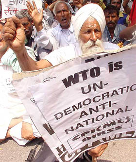 A farmer from Punjab raises slogans during an anti-WTO rally
