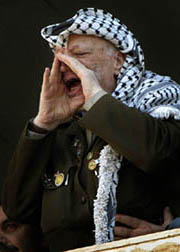 Palestinian President Yasser Arafat shouts during a rally in the West Bank city of Ramallah on Saturday
