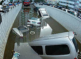 Vehicles float at a parking garage after a typhoon lashed through Masan