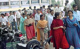Candidates come out of the examination hall after taking the entrance test for the JBT course 