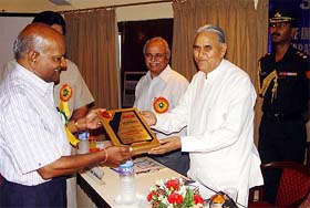 Haryana Governor Babu Parmanand felicitating B. R. Gupta at the 36th Engineers' Day  in Ambala