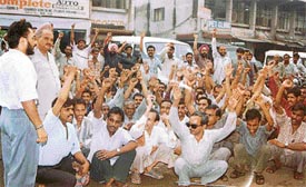 Workers of Bhogal Sons stage dharna outside the labour office in Ludhiana on Monday