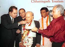 Thespian Dilip Kumar offers birthday cake to veteran film maker G. P. Sippy 