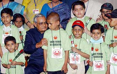 Prime Minister Atal Bihari Vajpayee with children of Cancer Patient Aid Association at his residence in New Delhi
