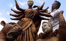 A craftsman makes an idol of Durga in Bangalore