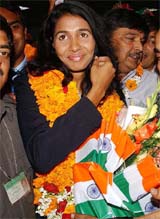 Anju Bobby George, long jump bronze medallist at the World Athletics championships, arrives at Indira Gandhi International Airport in New Delhi