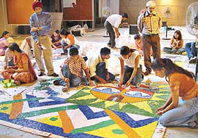 Students of Government College of Art, Sector 10, Chandigarh, make murals for the Delhi Metro Rail Project on their college campus on Thursday.
