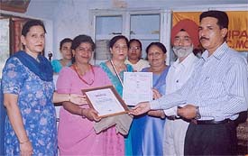 Ms Kusum Lata, winner of the state teachers� award, and Ms Gurcharan K. Kochhar, winner of the national teachers� award, being honoured