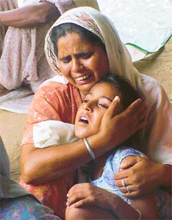 Gaganpreet Kaur, alias Laddi, daughter of Surinder Kaur, being consoled by a relative at their residence
