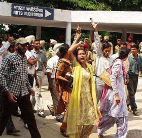Students raise slogans against the Punjabi University authorities on the university campus in Patiala