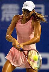 Maria Sharapova of Russia returns the ball during her second round match against Maria Sanchez Lorenzo of Spain 