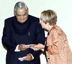Prime Minister Atal Bihari Vajpayee receives the first copy of his poems