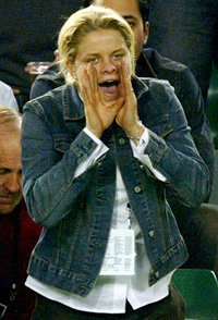Top women's tennis player Kim Clijsters from Belgium, who's also the girlfriend of Australia�s Lleyton Hewitt, shouts to encourage Australia�s Mark Philippoussis 
