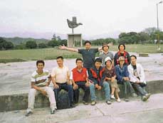 School teachers from Thailand pose for a photograph at the open-hand monument in Chandigarh on Tuesday.