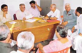 Mr Yash Pal Mahajan (fourth from left) files his nomination papers for the post of BJP president of the local unit at the BJP office in Sector 33, Chandigarh, on Saturday. 