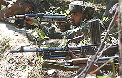 Soldiers take up position during a gunfight