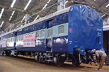 An official gives final touches to India’s first fireproof coach