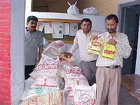 Owners of the T-Series company show the detergent packs of G-Series at a local police station 