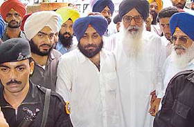 Former Chief Minister of  Punjab Parkash Singh Badal and his son Sukhbir Singh Badal appear before the Districts Court in Chandigarh