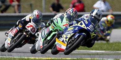 The pack of 125 cc class riders, lead by Spain's Daniel Pedrosa make their way at Rio Grand Prix in Rio de Janeiro