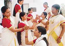 Girls perform traditional dance during the Onam celebrations
