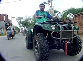Daljit Singh, a young farmer, who has brought a snow bike from Canada