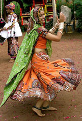 A Gujarati folk dancer, dressed in traditional attire, practices Garba dance for the upcoming Navratri festival, in Ahmedabad 