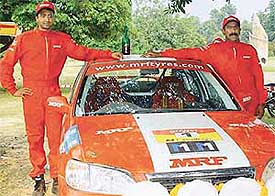 VR Naren Kumar and navigator D Ram Kumar of Team MRF after winning the Power M1 Challenge rally