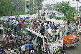 Army hopefuls arrive in Hamirpur on Monday to take part in a recruitment rally