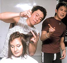 HAUTE COIFFURE: Schwarekopf professional at it during the Essential Looks, Autumn/Winter Collection 2003 at a press conference in the Capital on Monday.